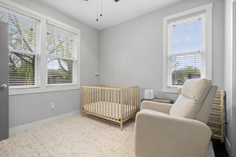 a living room with furniture and windows