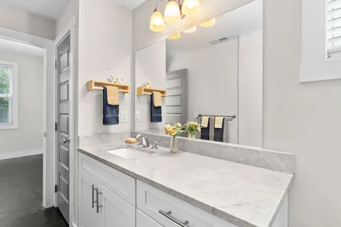 a bathroom with a sink double vanity and a mirror