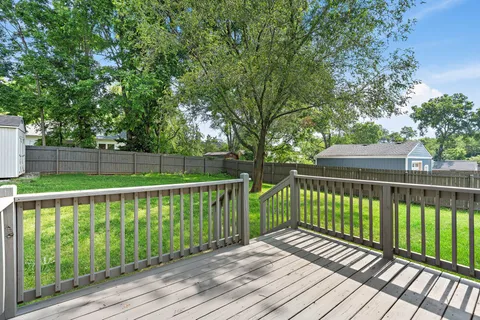 a view of deck with wooden floor and fence