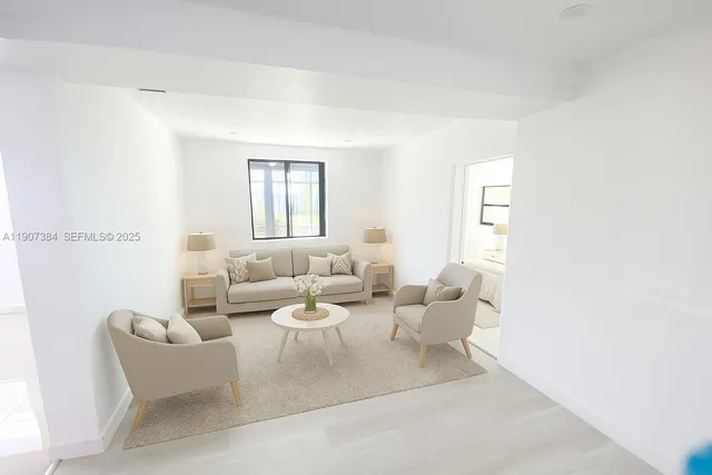 a living room with furniture and a window