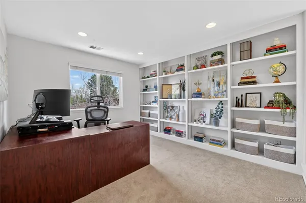 a view of a workspace with furniture