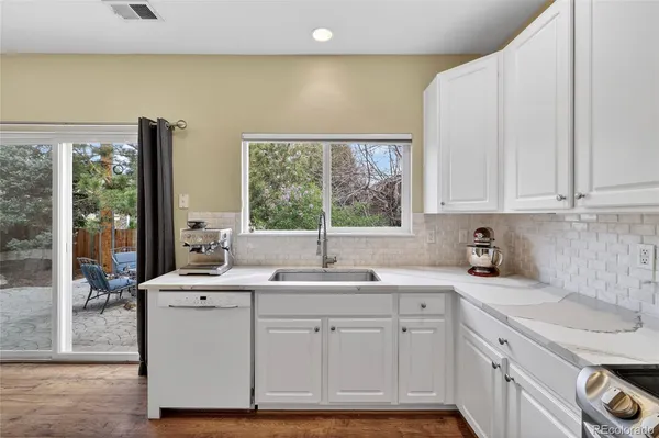 a kitchen with sink cabinets and window