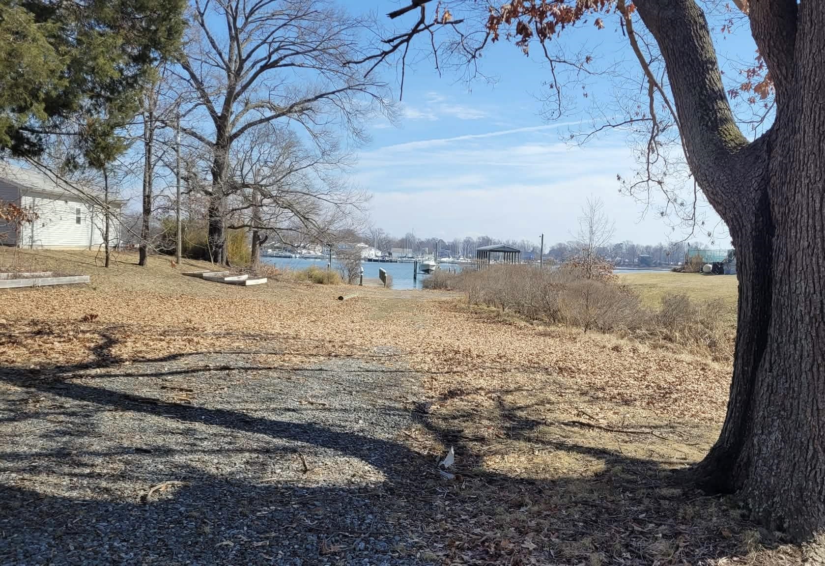 Monroe Bay Circle Colonial Beach, VA 22443 - Photo 2 of 6 a view of a yard with snow on the road