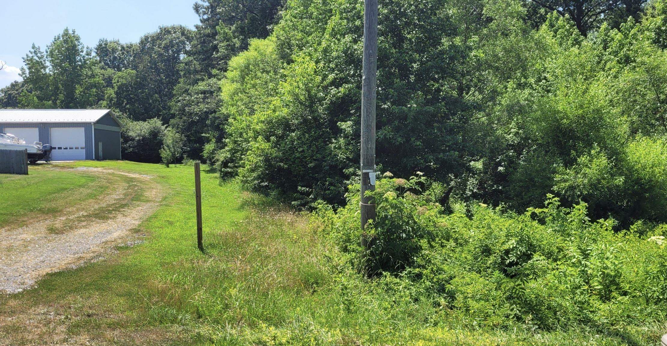 Monroe Bay Circle Colonial Beach, VA 22443 - Photo 5 of 6 a view of a house with a backyard