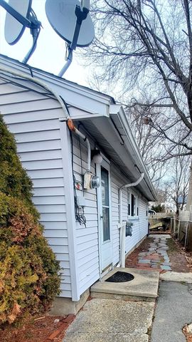 a view of a car park in front of house