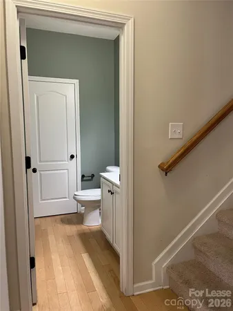 a view of a hallway with kitchen