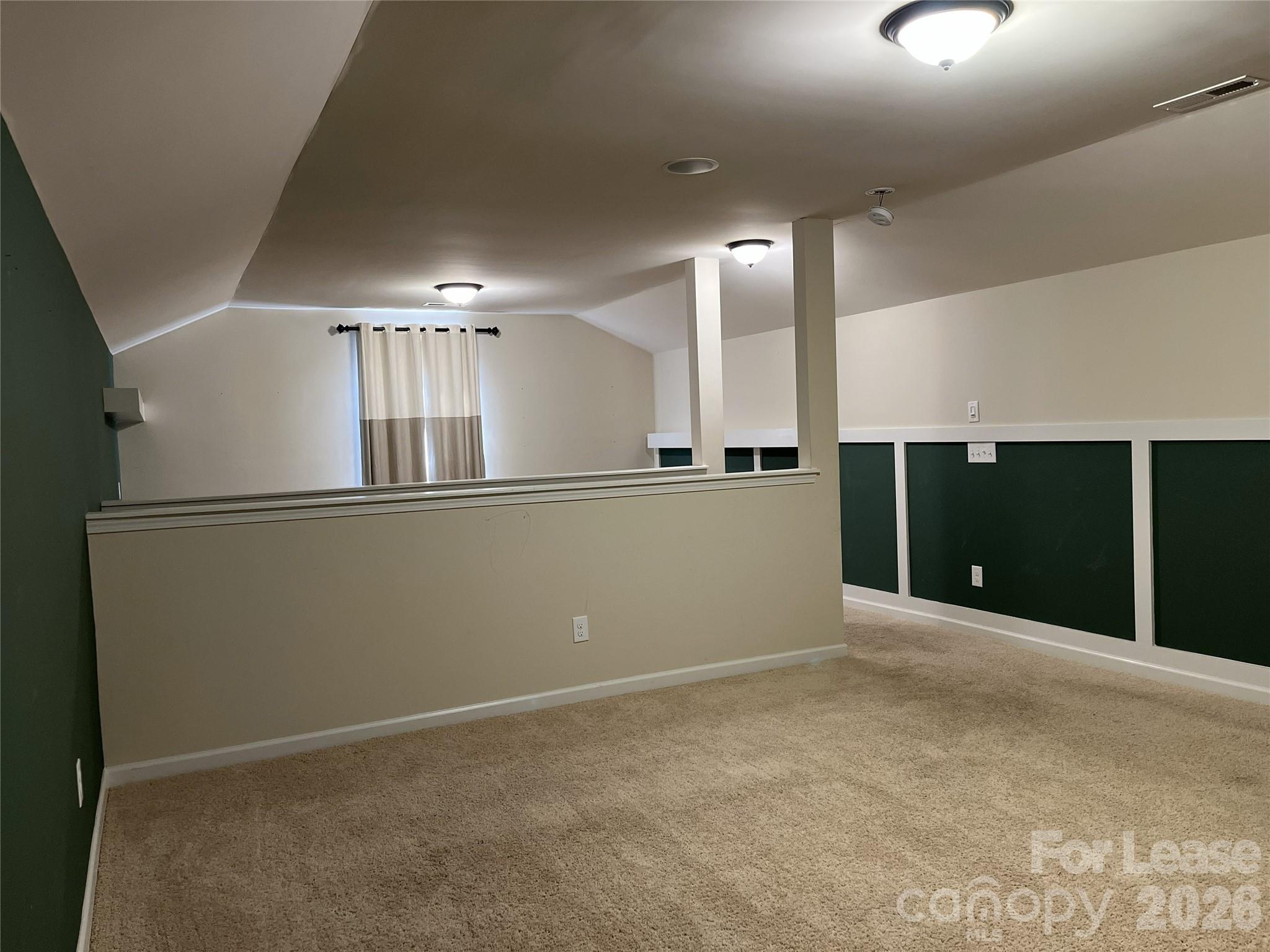 105 East Neel Ranch Road Mooresville, NC 28115 - Photo 24 of 27 an empty room with wooden floor and windows