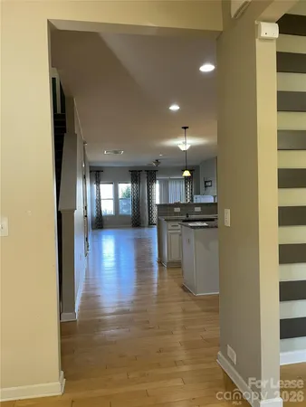a view of kitchen with furniture and wooden floor
