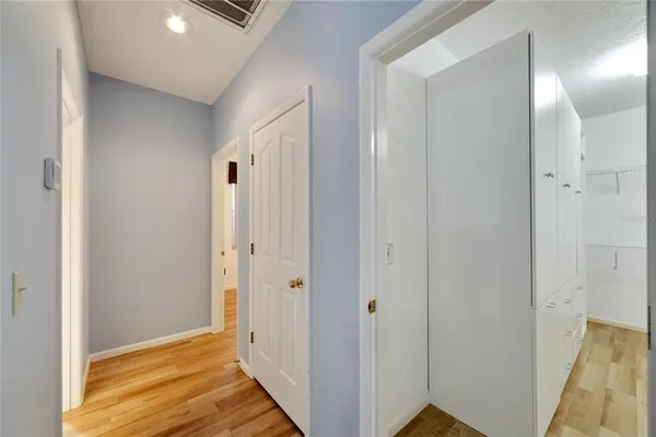 a kitchen with a refrigerator and a sink
