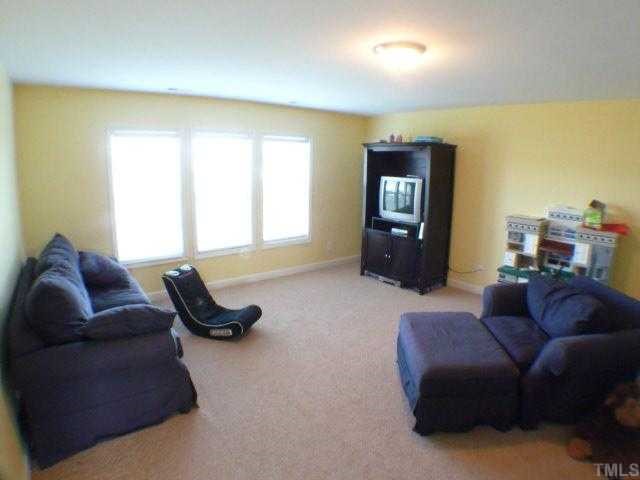 5208 Holly Ridge Farm Road Raleigh, NC 27616 - Photo 10 of 12 a living room with furniture and a window