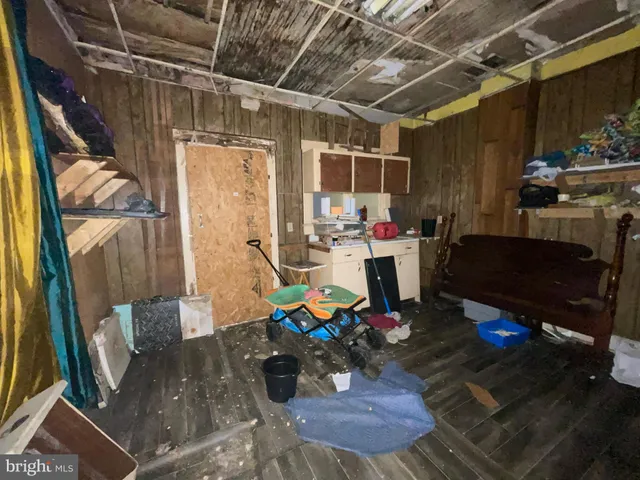 a room with lots of furniture and a fireplace