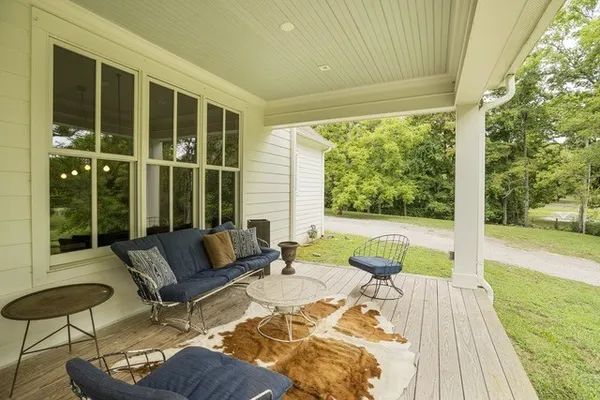 a outdoor living space with furniture and garden view