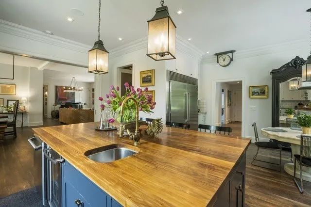 a kitchen with sink and refrigerator