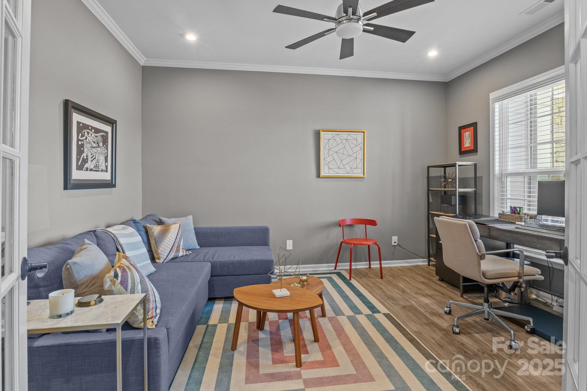 12709 Messenger Row Huntersville, NC 28078 - Photo 11 of 45 a living room with furniture a flat screen tv and a window