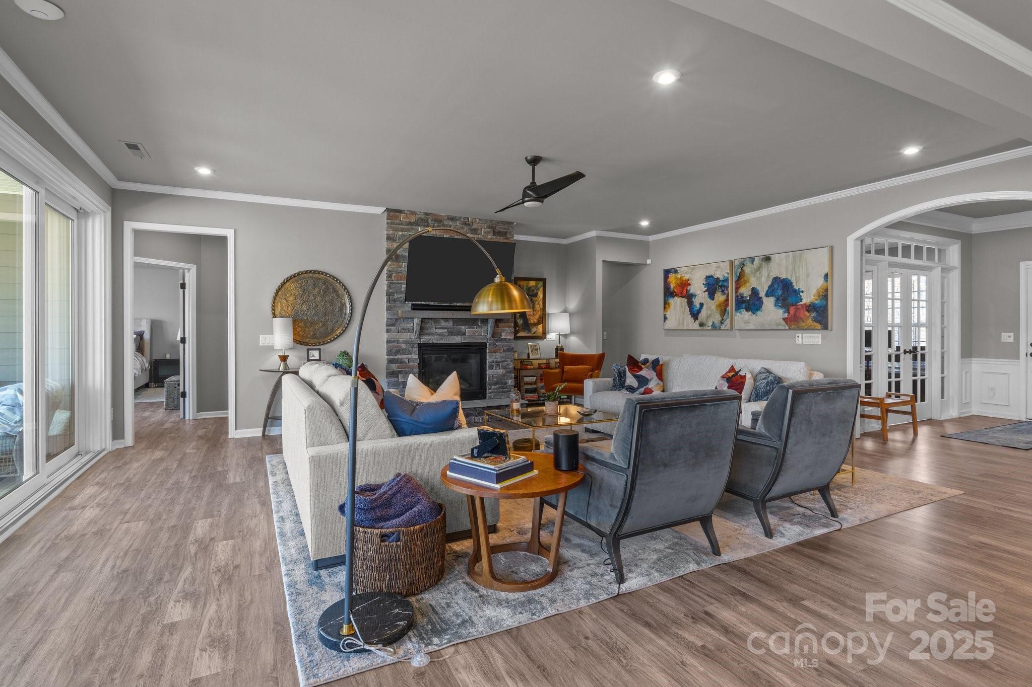 12709 Messenger Row Huntersville, NC 28078 - Photo 17 of 45 a living room with furniture a rug and wooden floor