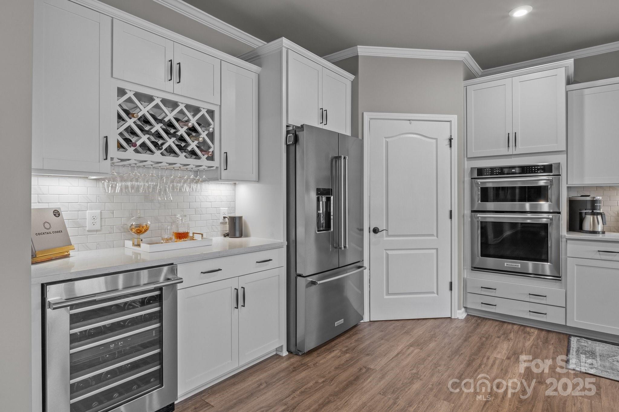 12709 Messenger Row Huntersville, NC 28078 - Photo 20 of 45 a kitchen with stainless steel appliances a refrigerator sink and microwave