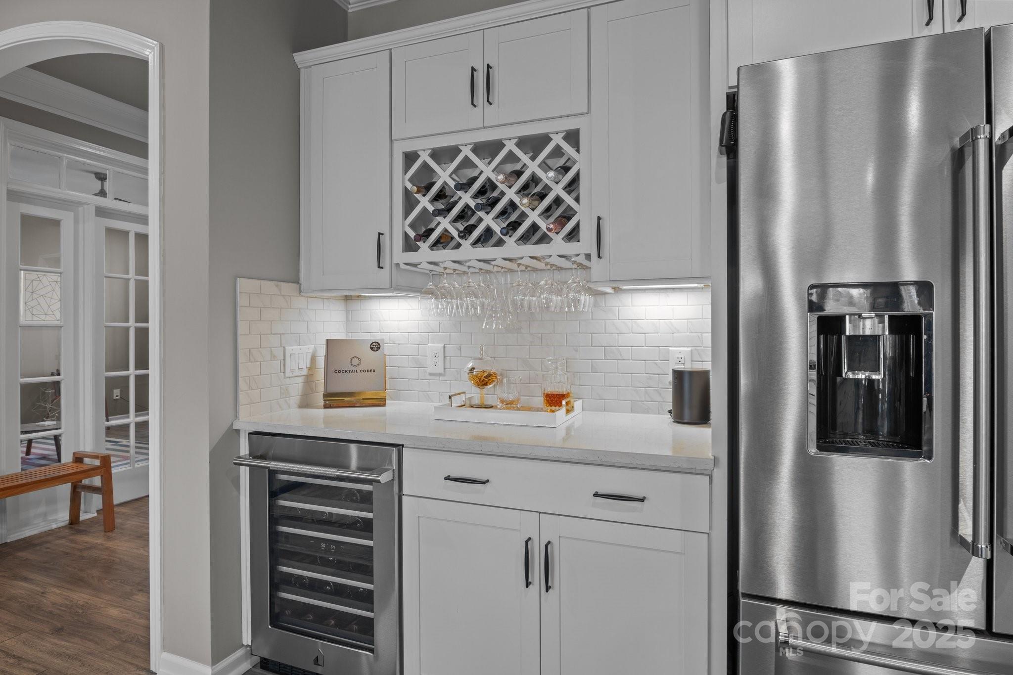 12709 Messenger Row Huntersville, NC 28078 - Photo 21 of 45 a kitchen with stainless steel appliances a refrigerator and cabinets