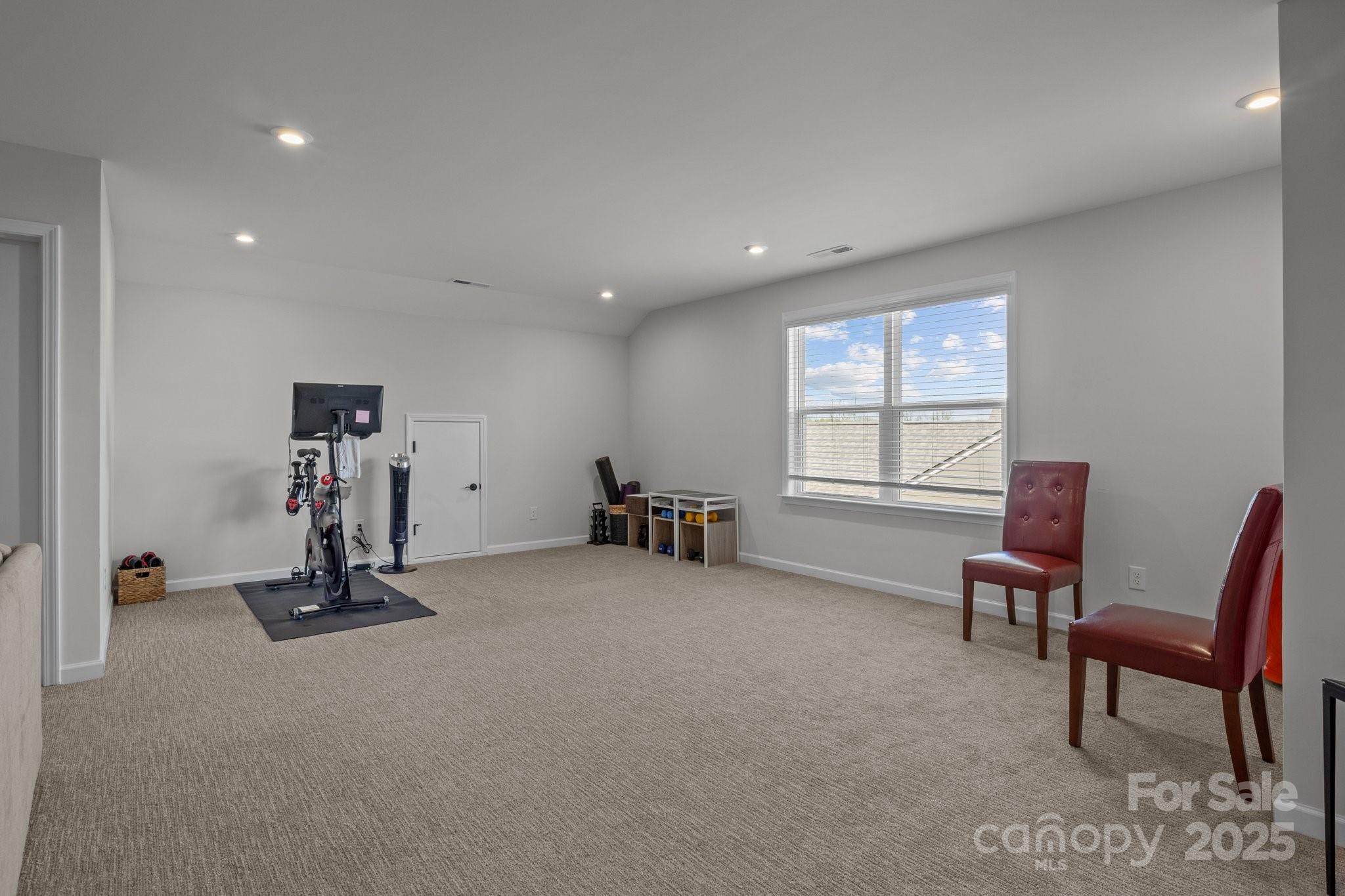 12709 Messenger Row Huntersville, NC 28078 - Photo 36 of 45 a view of a room with gym equipment