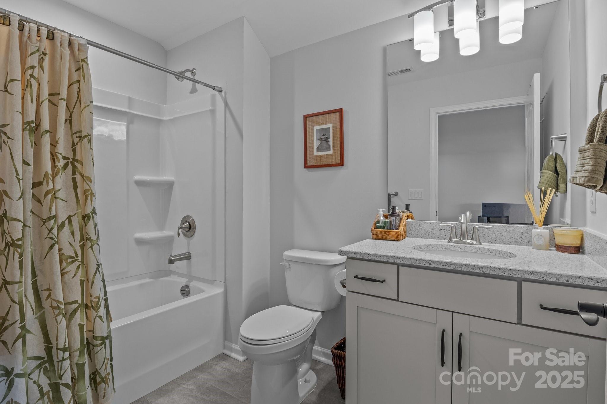 12709 Messenger Row Huntersville, NC 28078 - Photo 37 of 45 a bathroom with a sink a toilet and a bathtub