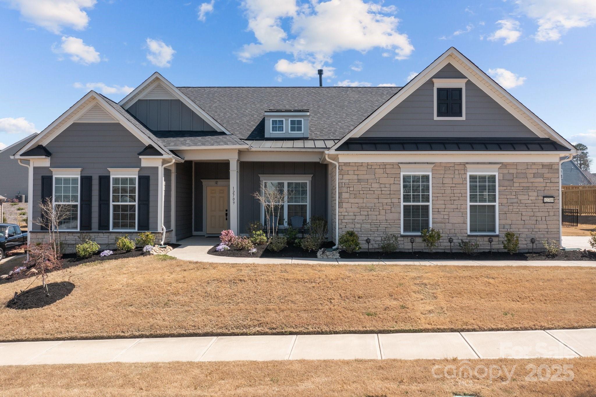 12709 Messenger Row Huntersville, NC 28078 - Photo 5 of 45 a front view of a house with a yard and outdoor seating