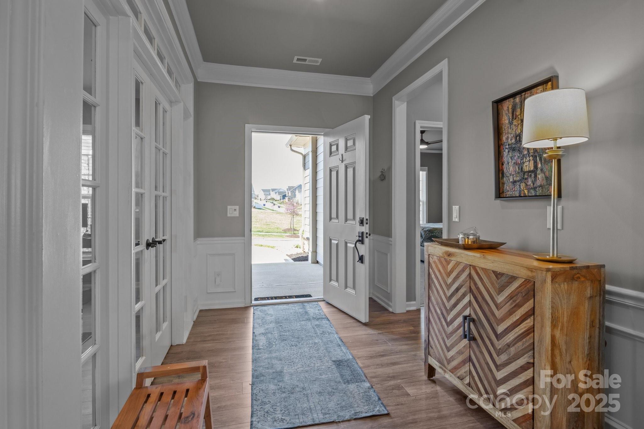 12709 Messenger Row Huntersville, NC 28078 - Photo 10 of 45 a view of a hallway with wooden floor and a mirror