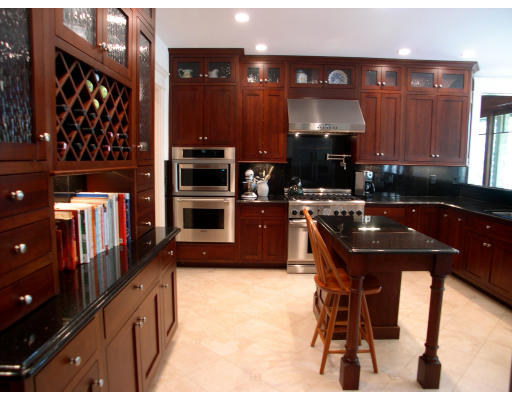 4 Robin Road Weston, MA 02493 - Photo 3 of 10 a kitchen with stainless steel appliances wooden cabinets and a counter top space