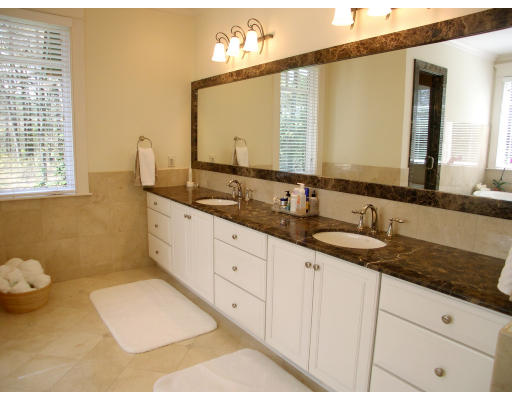 4 Robin Road Weston, MA 02493 - Photo 9 of 10 a bathroom with a granite countertop sink and a mirror