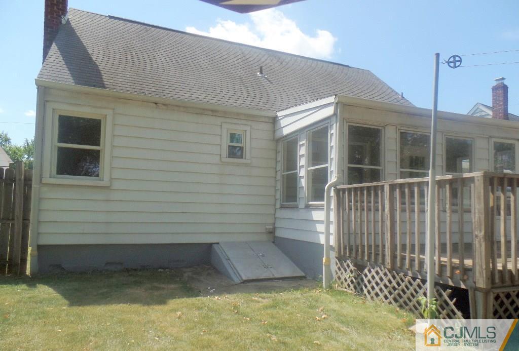 195 Midfield Road Colonia, NJ 07067 - Photo 18 of 21 a view of a house with a small yard and wooden fence
