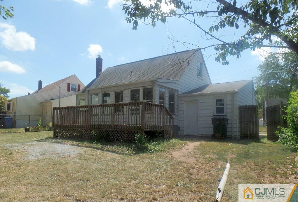 195 Midfield Road Colonia, NJ 07067 - Photo 19 of 21 a front view of a house with a yard and garage