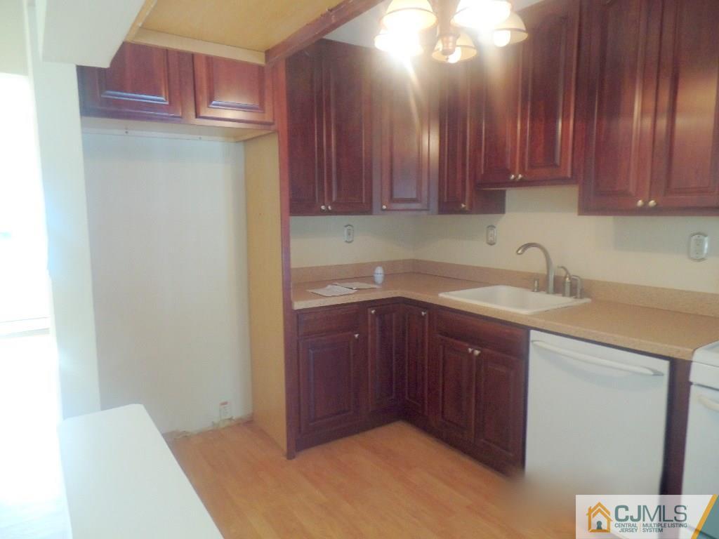 195 Midfield Road Colonia, NJ 07067 - Photo 3 of 21 a kitchen with a sink and cabinets