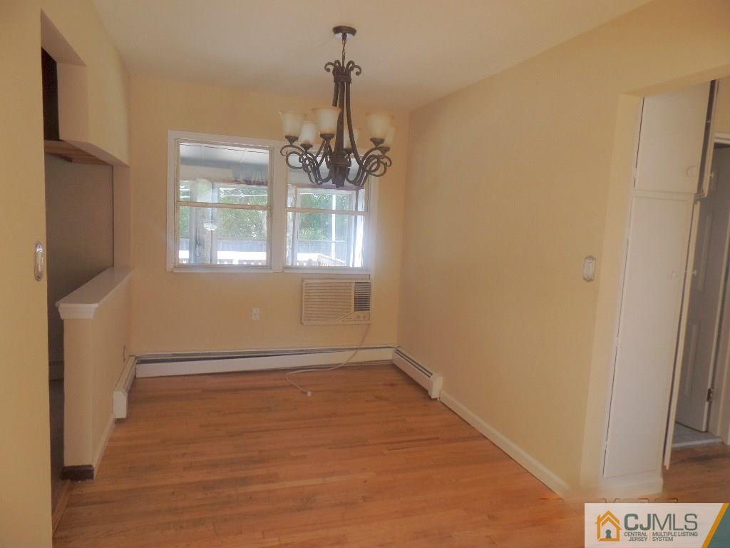 195 Midfield Road Colonia, NJ 07067 - Photo 4 of 21 a view of an empty room with a window