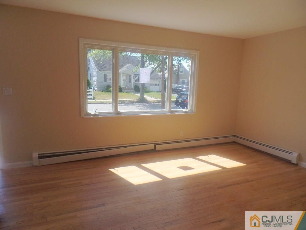 195 Midfield Road Colonia, NJ 07067 - Photo 5 of 21 an empty room with a window