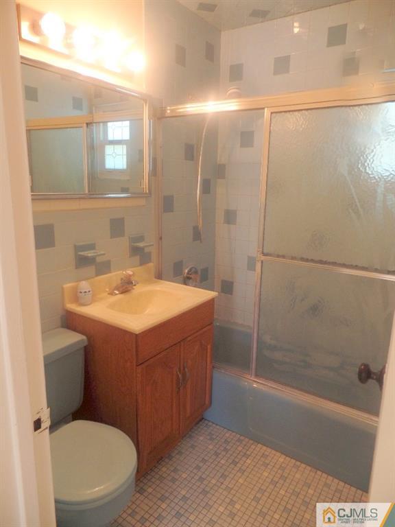 195 Midfield Road Colonia, NJ 07067 - Photo 8 of 21 a bathroom with a sink a toilet and shower