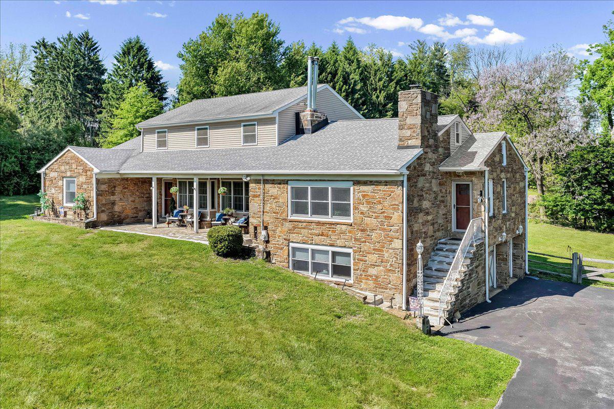 779 Concord Road Glen Mills, PA 19342 - Photo 2 of 41 Charming stone home nestled in lush greenery.