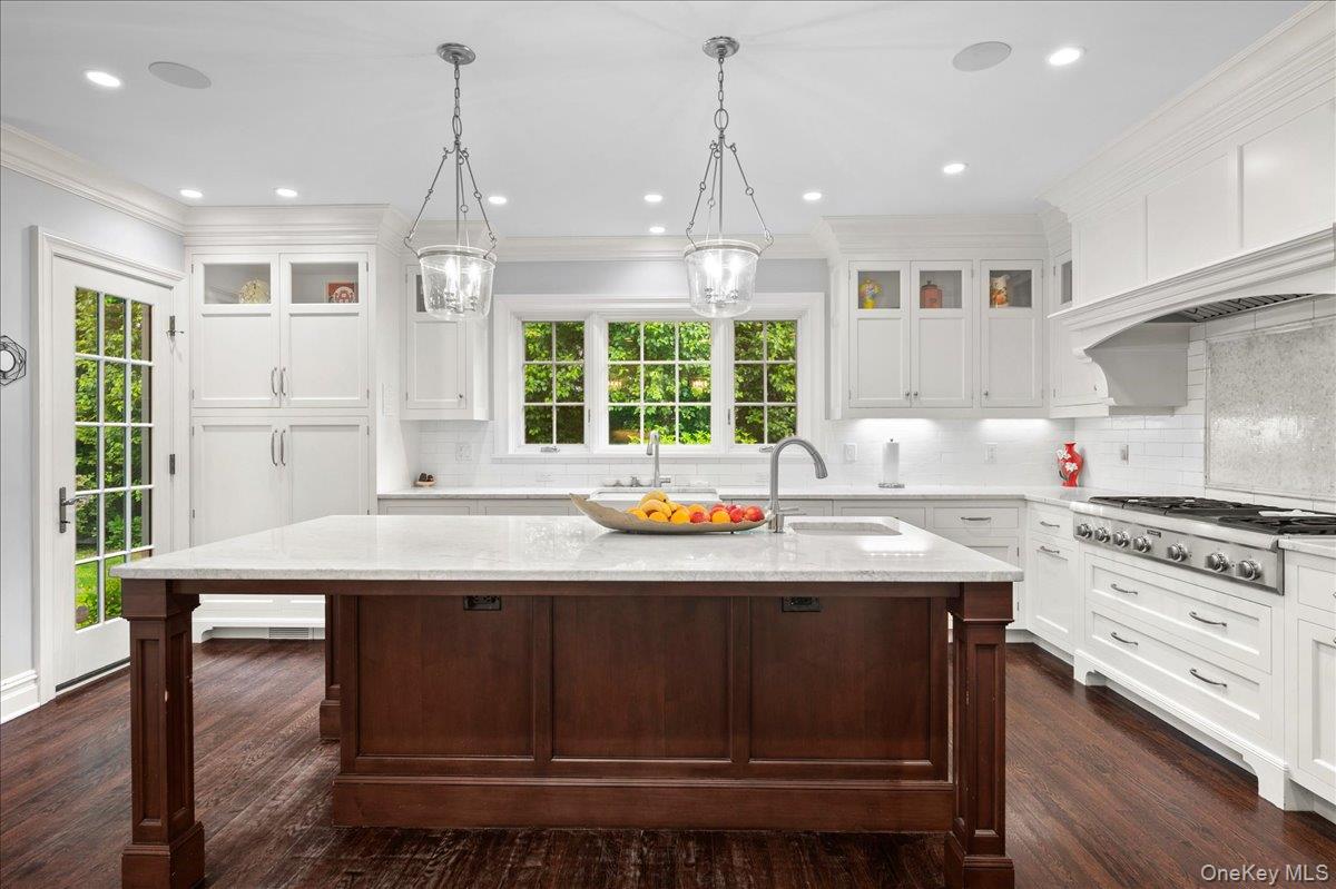 7 Harcourt Road Scarsdale, NY 10583 - Photo 8 of 34 a kitchen with granite countertop a stove a sink and a wooden floors