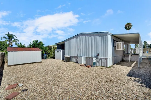 a view of a backyard with a sitting area