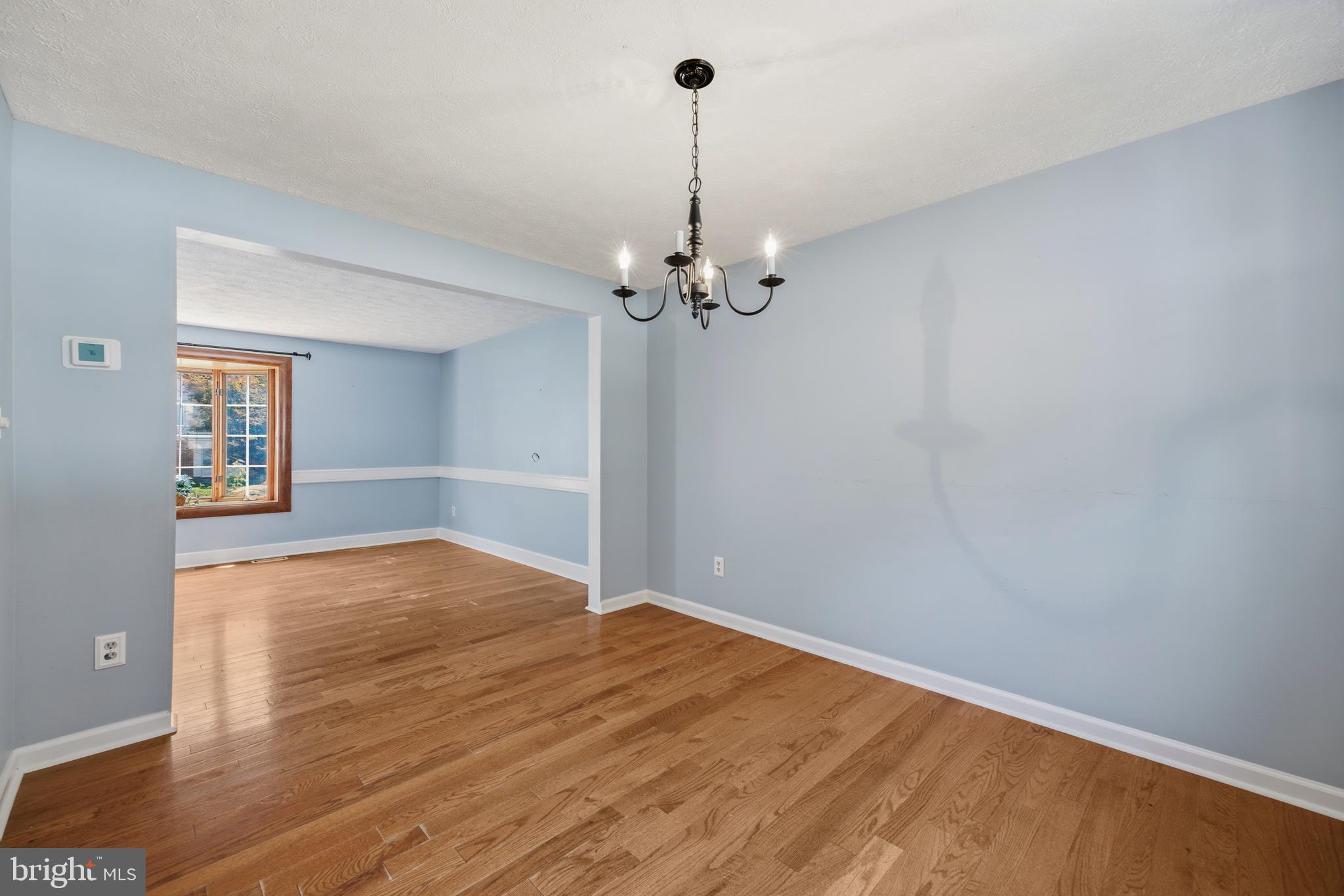 1506 Gollum Road Hanover, MD 21076 - Photo 11 of 44 a view of a room with wooden floor and a ceiling fan