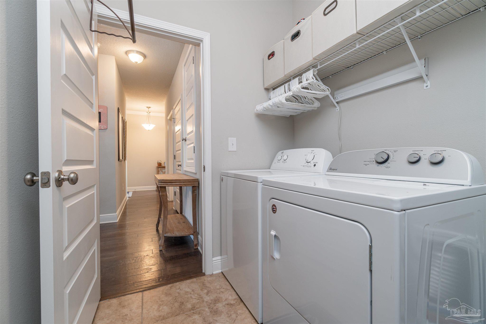 7997 Woodbrook Road Pensacola, FL 32526 - Photo 11 of 35 a view of hallway with washer and dryer