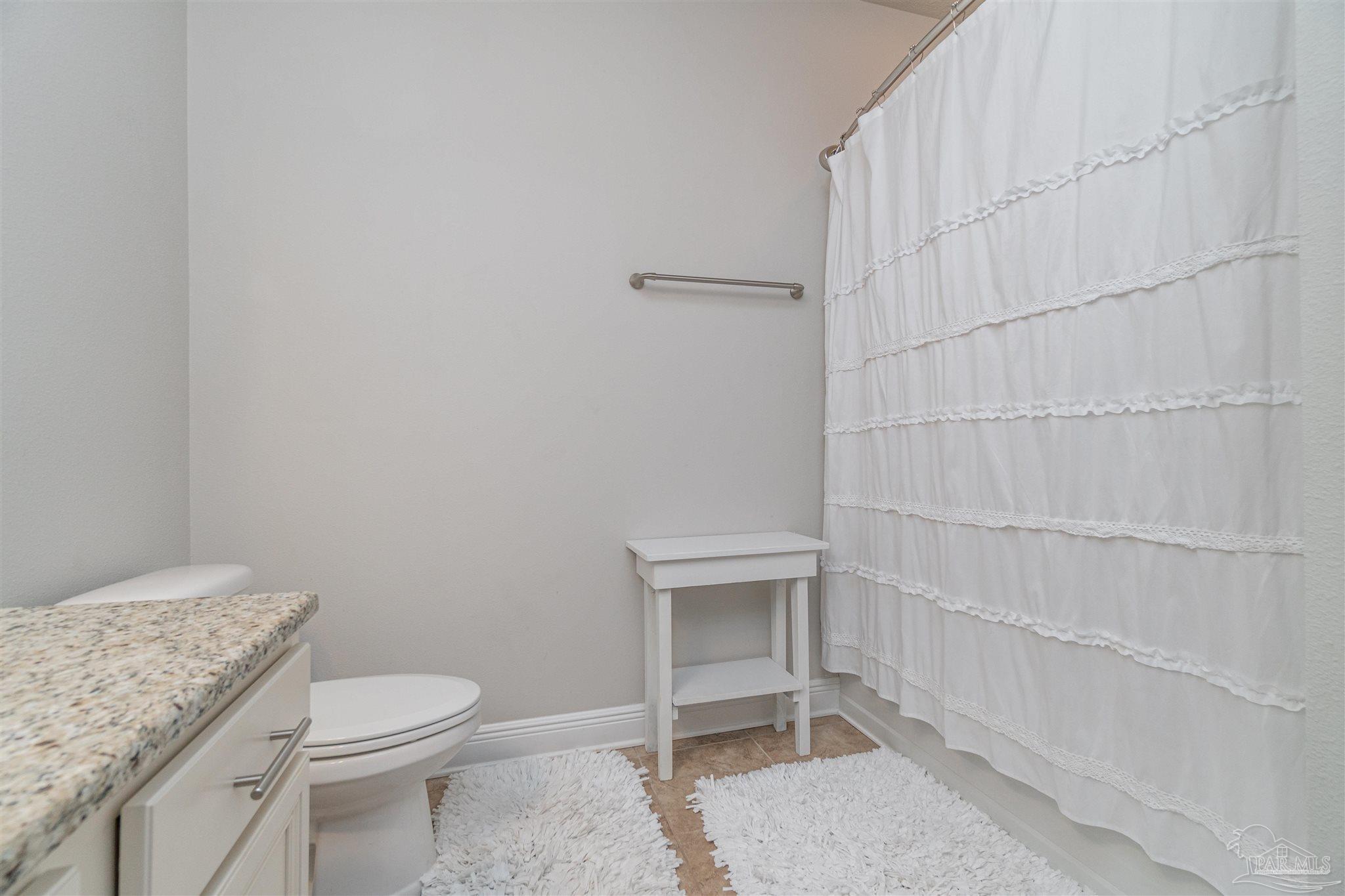 7997 Woodbrook Road Pensacola, FL 32526 - Photo 13 of 35 a bathroom with a toilet