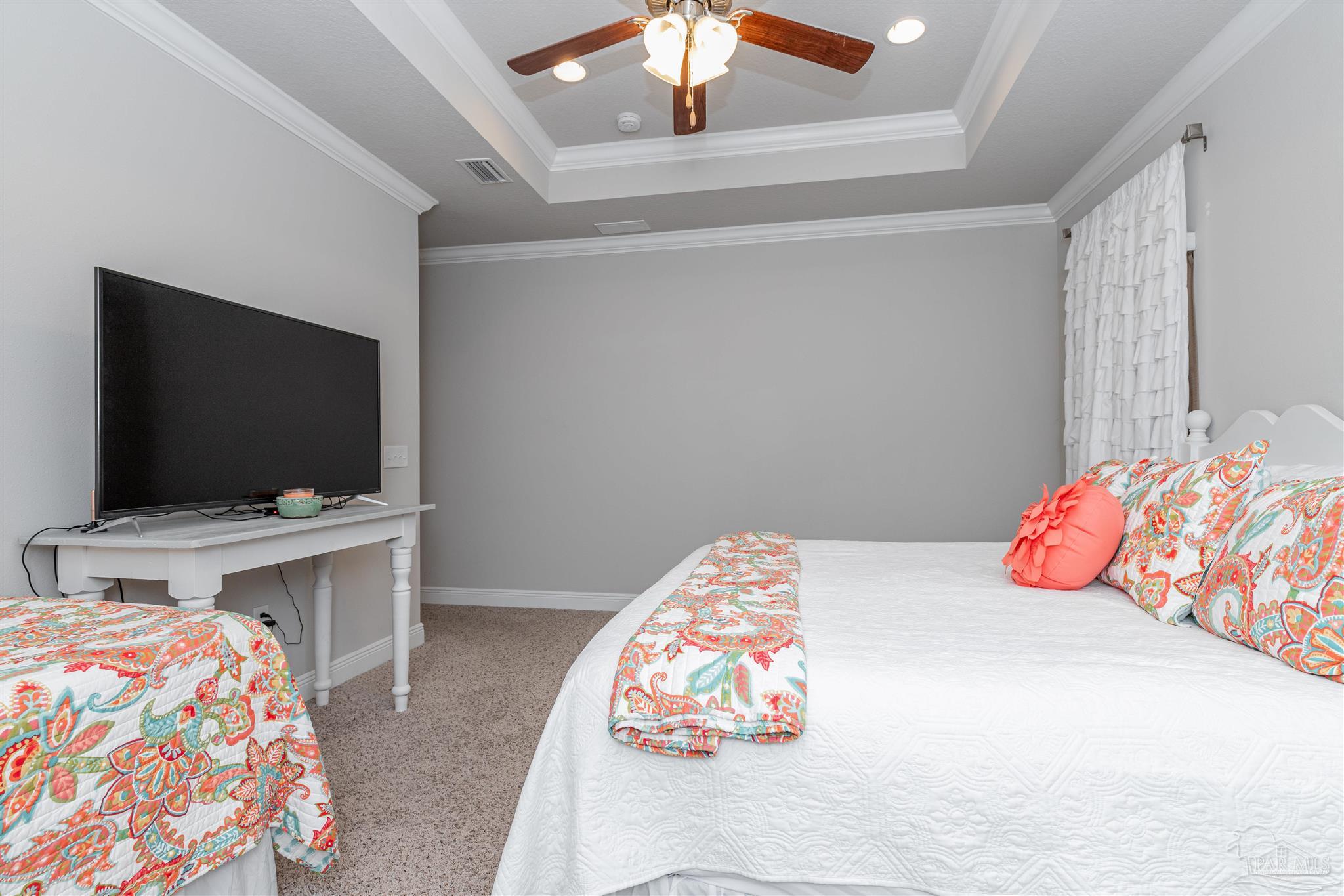 7997 Woodbrook Road Pensacola, FL 32526 - Photo 32 of 35 a bedroom with a bed and a flat screen tv