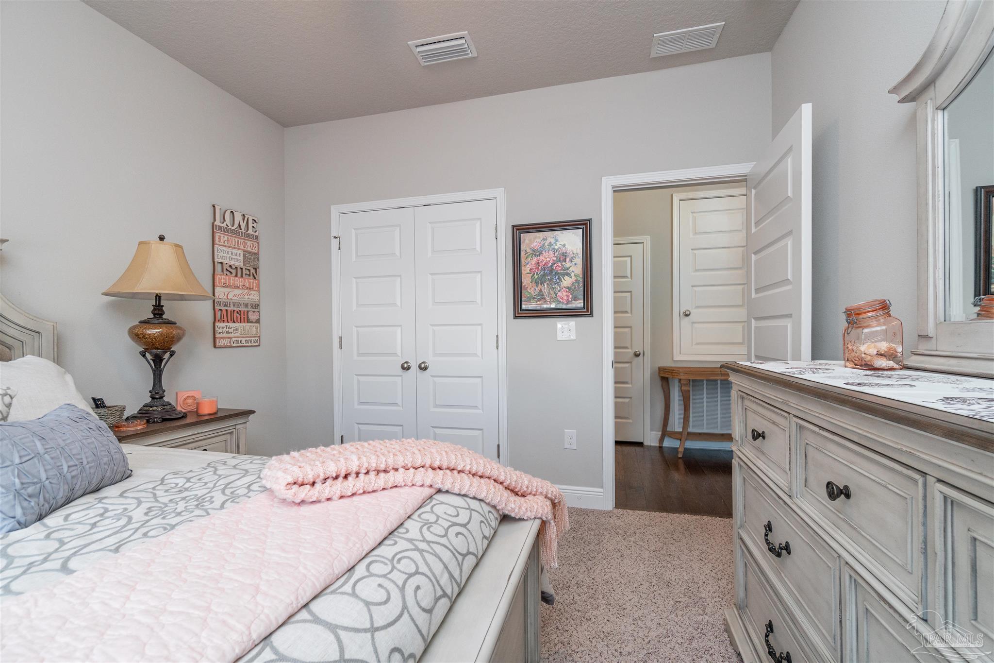 7997 Woodbrook Road Pensacola, FL 32526 - Photo 7 of 35 a bedroom with a bed and a dresser