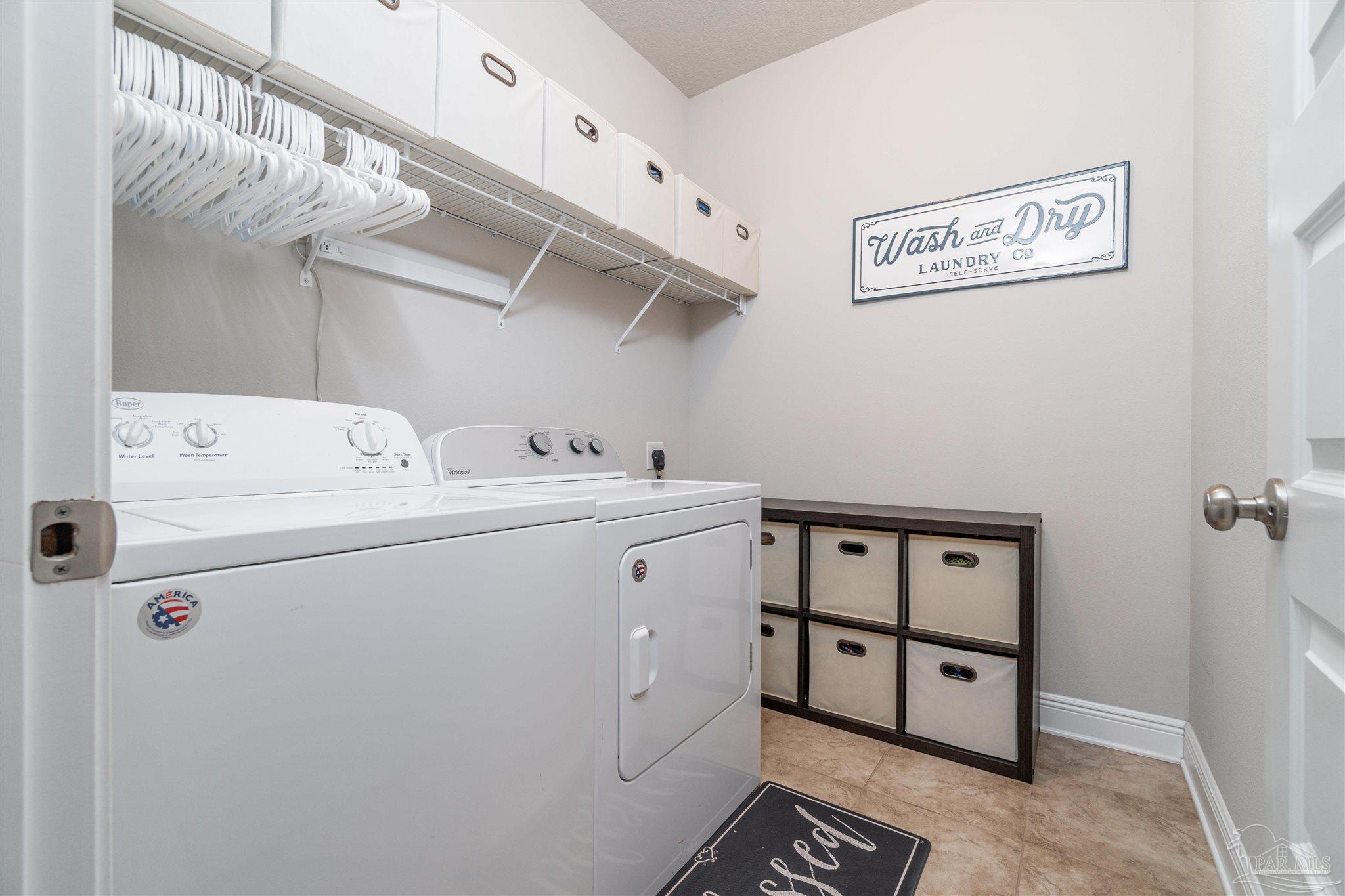 7997 Woodbrook Road Pensacola, FL 32526 - Photo 10 of 35 a utility room with dryer and washer