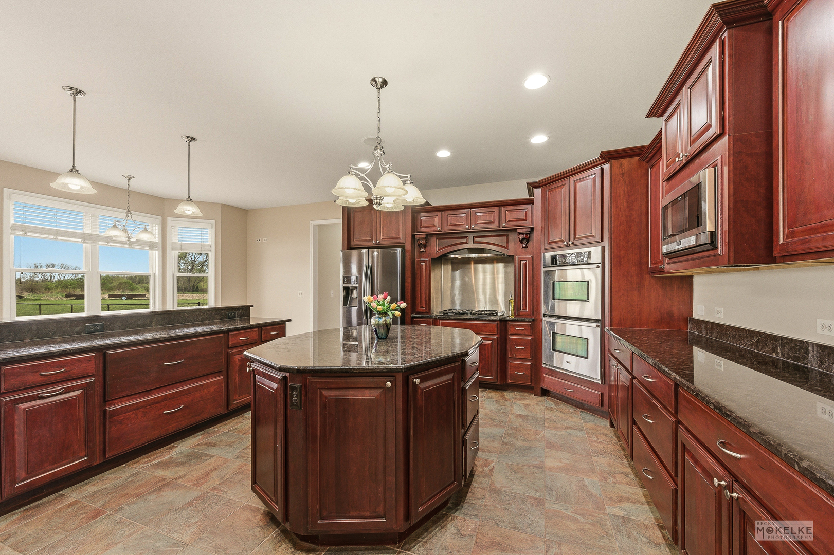 2953 4459th Road Newark, IL 60541 - Photo 13 of 39 a kitchen with granite countertop counter top space a sink stainless steel appliances and cabinets