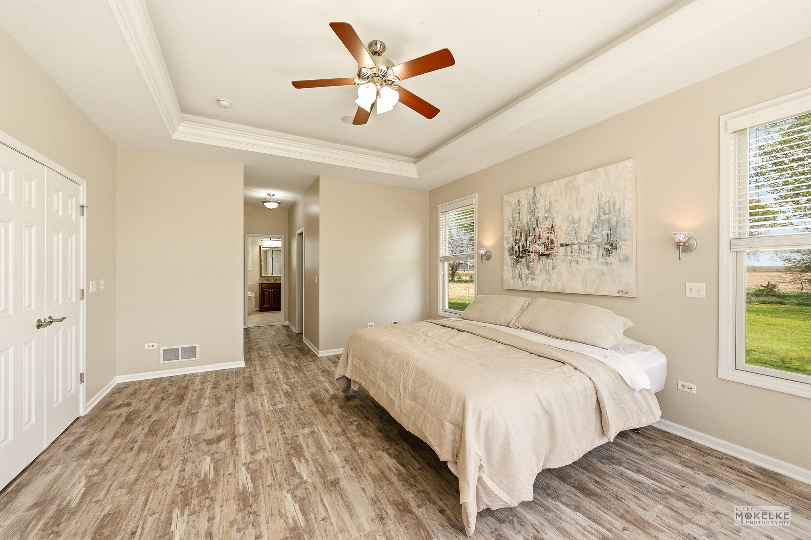 2953 4459th Road Newark, IL 60541 - Photo 18 of 39 a bedroom with a large bed a chandelier and a window