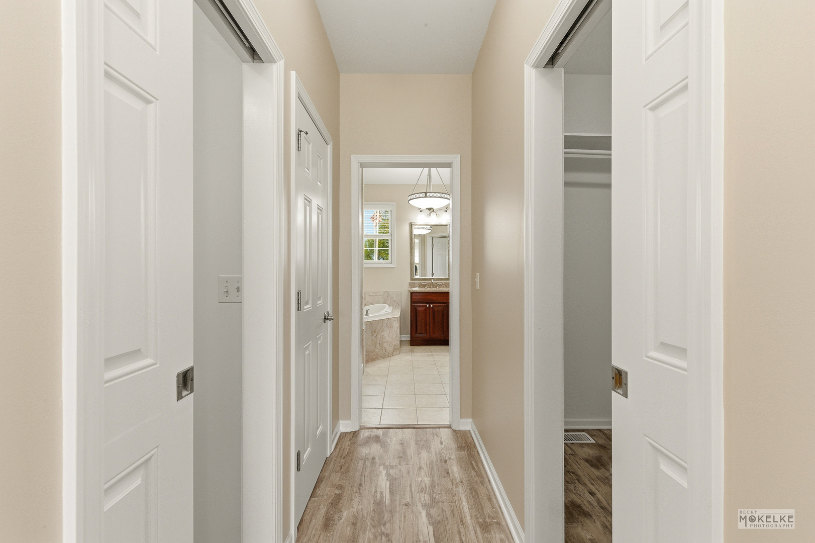 2953 4459th Road Newark, IL 60541 - Photo 19 of 39 a view of a hallway with wooden floor and a bathroom
