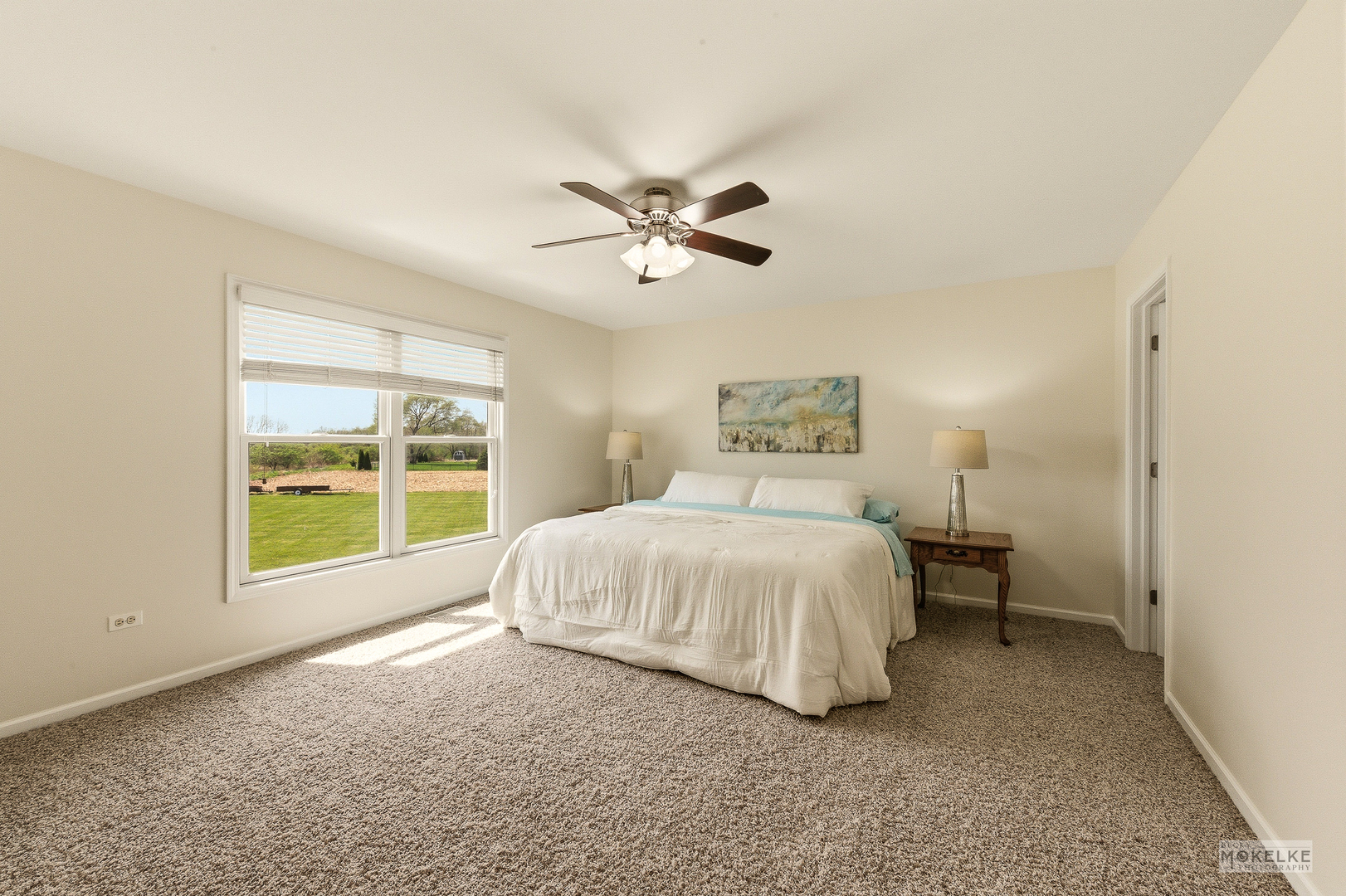2953 4459th Road Newark, IL 60541 - Photo 27 of 39 a spacious bedroom with a bed and a large window