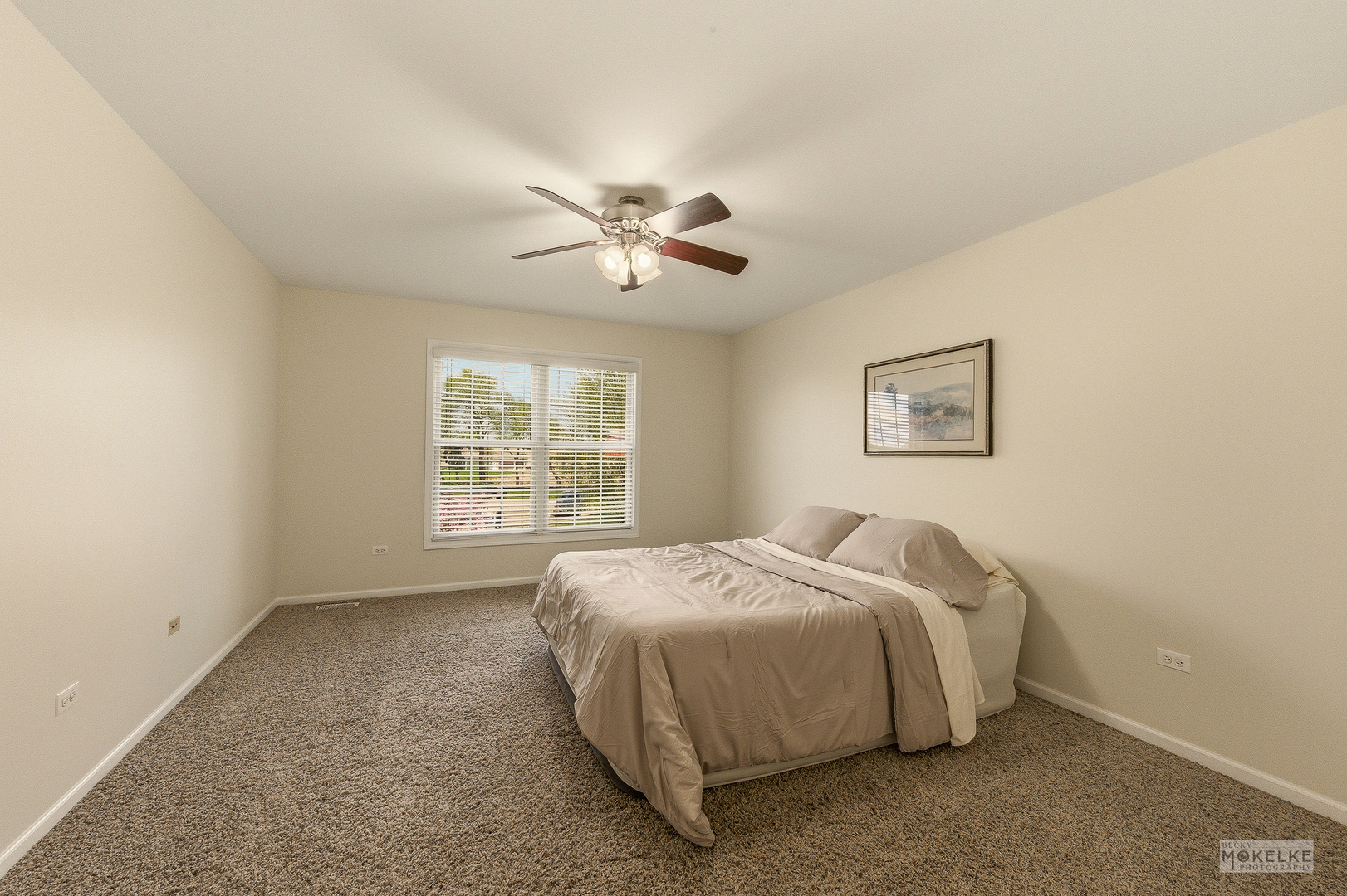 2953 4459th Road Newark, IL 60541 - Photo 29 of 39 a bed sitting in a bedroom next to a window