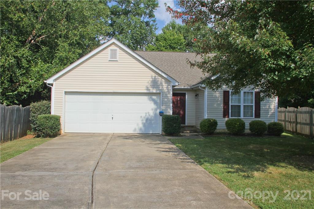 11233 Dickie Ross Road Charlotte, NC 28277 - Photo 1 of 26 a view of a house with a yard and large tree