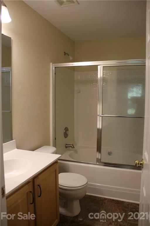 11233 Dickie Ross Road Charlotte, NC 28277 - Photo 12 of 26 a bathroom with a granite countertop sink toilet and shower