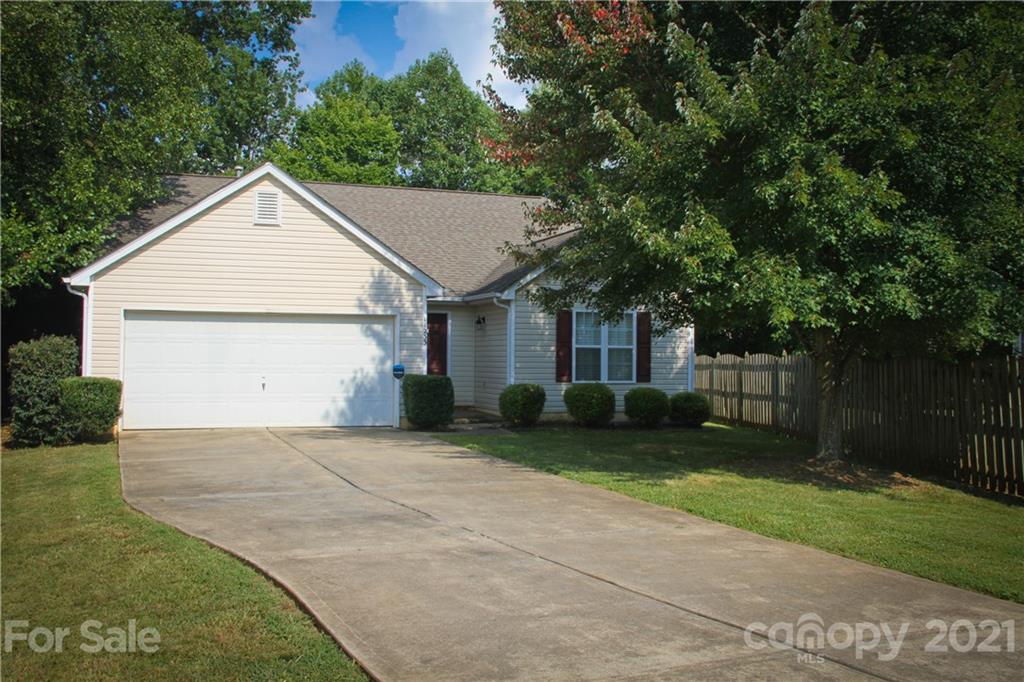 11233 Dickie Ross Road Charlotte, NC 28277 - Photo 20 of 26 a view of a house with a yard and large tree